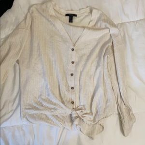 cream colored button down tie sweater